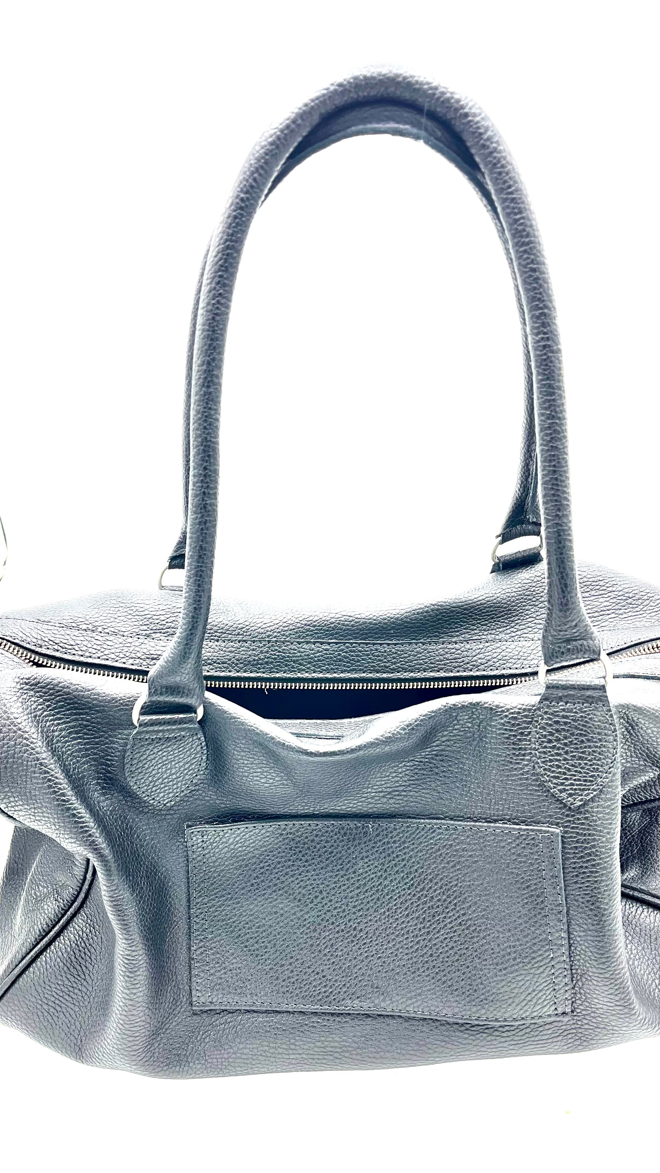 Bolso cuero negro muestra taller
