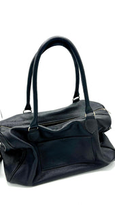 Bolso cuero negro muestra taller